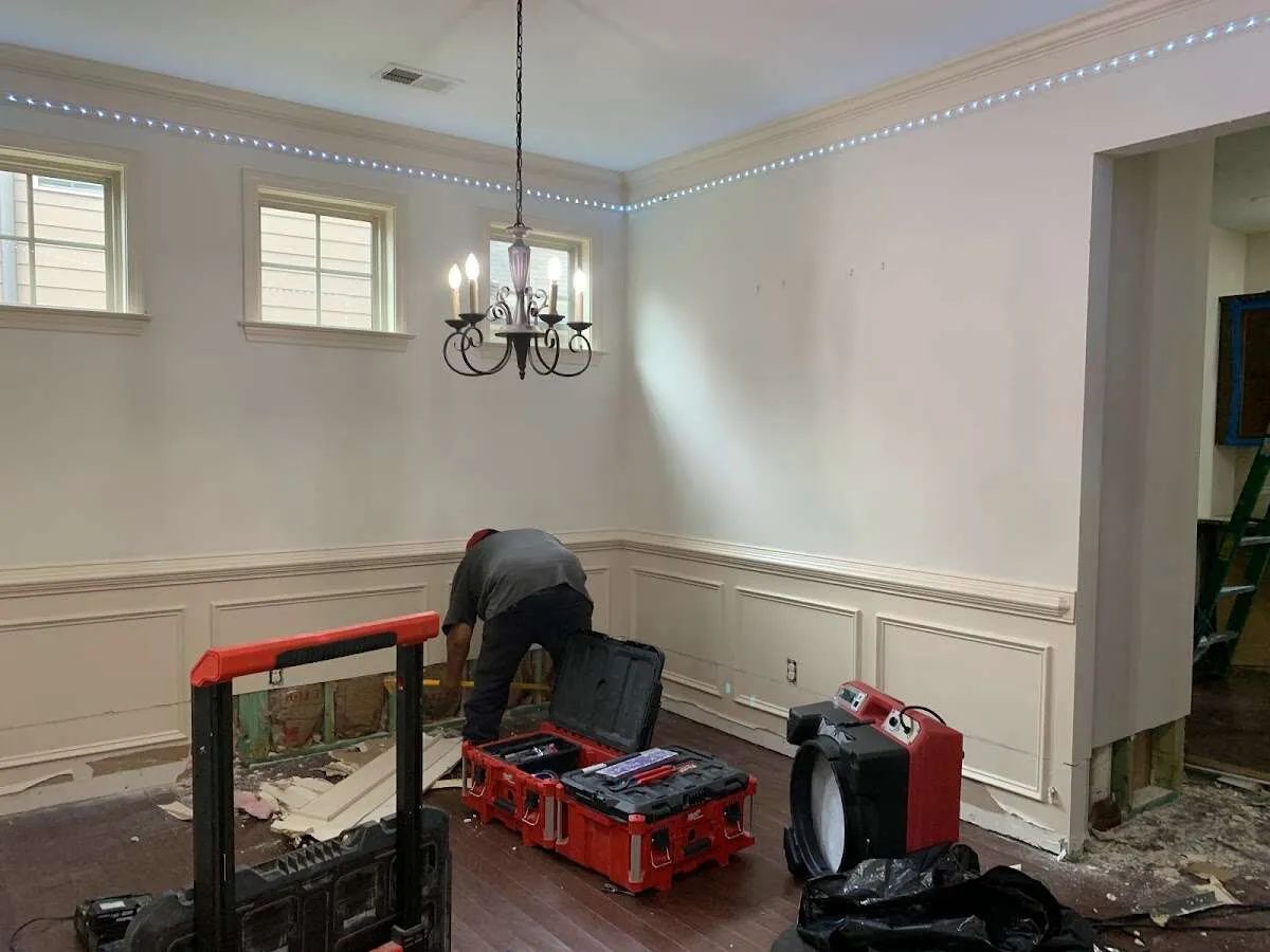 Restoration technician with professional equipment in Newark